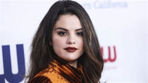 Watch Selena Gomez Look Alike Knocks Out Blonde On The Beach With One