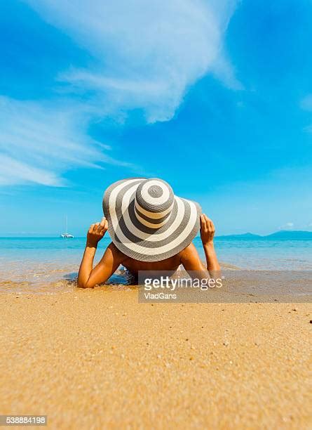 Woman Lying Down Beach Photos And Premium High Res Pictures Getty Images