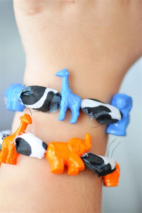 They take less than an hour to make and the supplies (and skills!) are minimal. Kara's Party Ideas DIY Jungle Animal Kids Beaded Bracelet ...