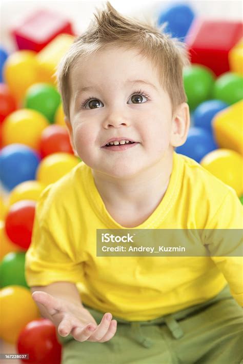 Cute Kid Or Child Playing Colorful Balls Top View Stock Photo