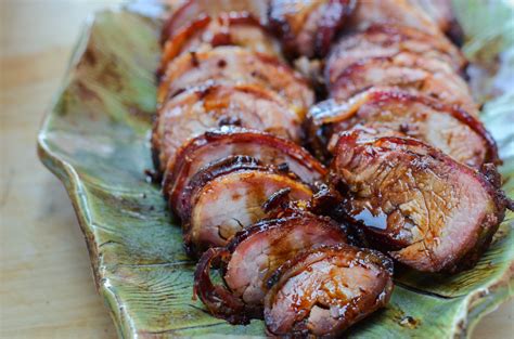 I know grilling would probably be best, but i live in an apt, so i'd wrap it up in foil in a glass dish with a little broth or water and a few small veggies. Bacon-Wrapped Pork Tenderloin - VeryVera