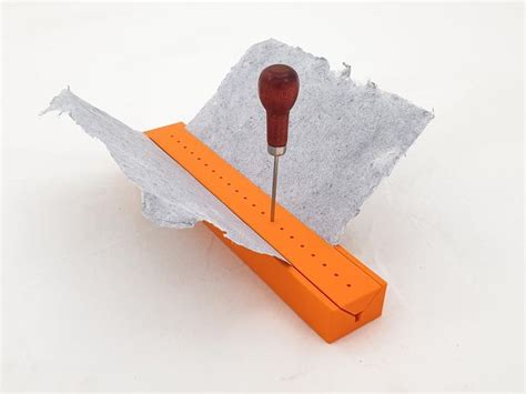 Signature Punching Tool For Bookbinding With An Awl Guide