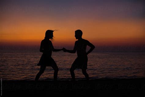 Anonymous Couple Dancing At The Beach By Stocksy Contributor Mosuno Stocksy
