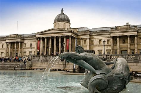 A Trafalgar Square Fountain In Front Of The National Gallery