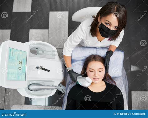 Beautician Performing Smas Lifting Procedure In Clinic Stock Photo
