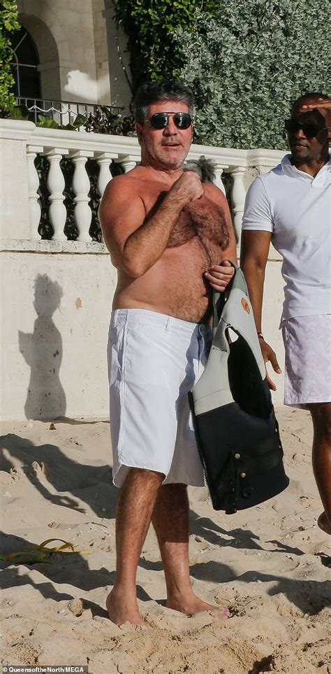 shirtless simon cowell tops up his tan in barbados during holiday with lauren silverman and son