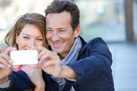 Mature Couple Taking Selfie In Town Stock Image Image Of Smiling Attractive 64558925