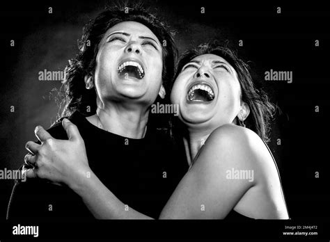 Two Asian Woman Sisters Korean Siblings Embrace Scream Open Mouth