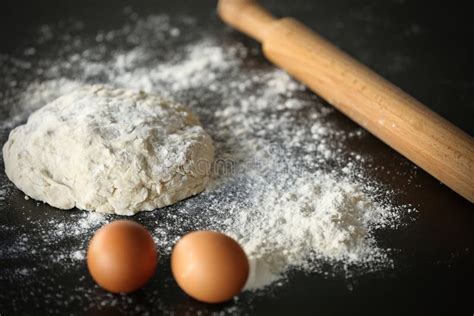 Dough With Flour Eggs And Rolling Pin Stock Photo Image Of