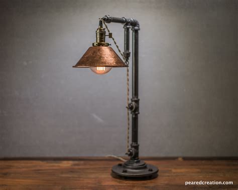 These quintessential lamps are often deployed in pairs, enlisted to bring balance to either side of a bed, sofa, console, or credenza. Rustic Iron Pipe Table Lamp | iD Lights