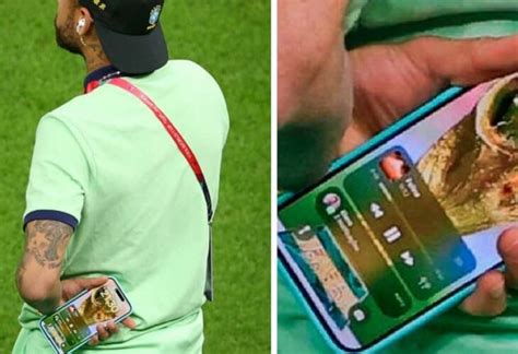 neymar muestra fondo de pantalla del celular con la copa mundo