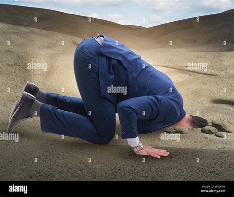 The Businessman Hiding His Head In Sand Escaping From Problems Stock