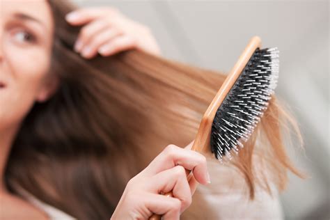 Babe Woman Brushing Her Hair Viviscal Healthy Hair Tips