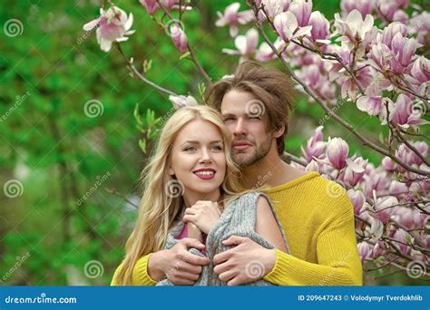 sensual couple hugging in love on blossoming flower spring love and romance relationship