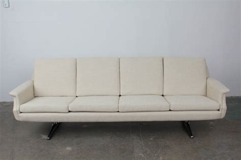 5 out of 5 stars. Mid Century Modern 4 seat sofa on metal legs. at 1stdibs