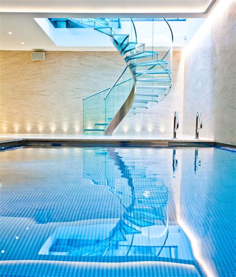 Pool And Wellness Area With Spiral Staircase Homify