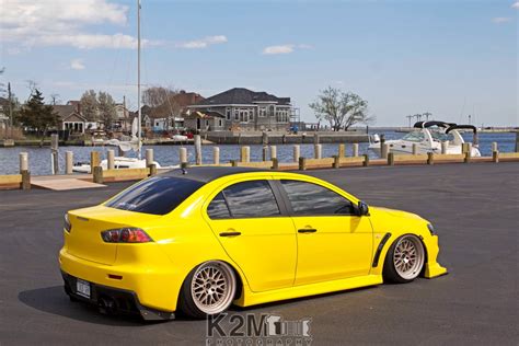 Online Crop Yellow Sedan Car Yellow Cars Mitsubishi Lancer Evo X