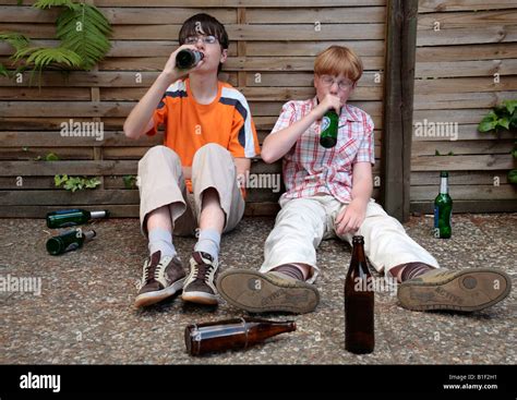 Posed Portrait Of Two Young Boys Drinking Beer Stock Photo Alamy