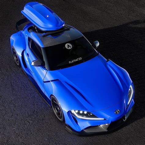 A Blue Sports Car With A Surfboard On Top