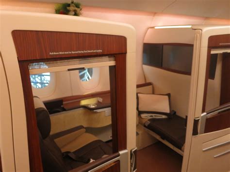 Suite (first) class features enclosed individual suites with a guest seat, and possibly the widest bed in the sky. Singapore Airlines Eliminating Half Its First Class Seats ...