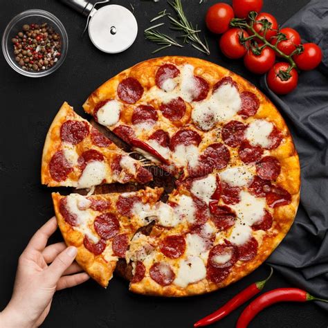 Female Hand Taking Slice Of Pepperoni Pizza Crop Stock Photo Image