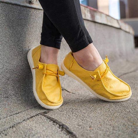 Then we redesign and reconstruct them using dude's patented sole technology and innovative design combines with lightweight, canvas uppers to produce the funkiest, comfiest ladies' shoes straight out of the box. Hey Dude Shoes Womens Wendy Canvas Shoes In Amber Yellow #closedshoesforladies | Leather shoes ...