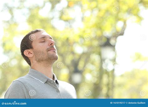 Relaxed Man Breathing Deeply Fresh Air Outside In A Park Stock Image