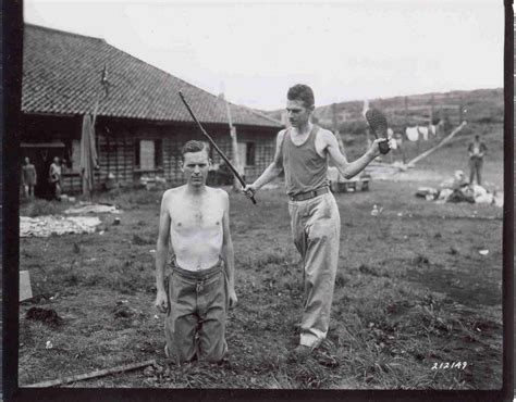 two pow s from rokuroshi pow camp in japan demonstrate to their