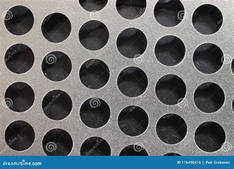 Round Holes In A Silver Sheet Of Metal Stock Photo Image Of Hard