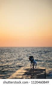 Silhouette Couple Standing Kissing Pier Watching Stock Photo Shutterstock