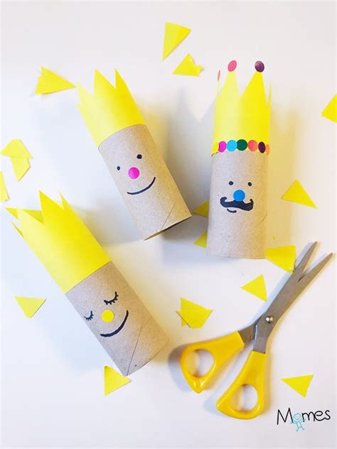 Three Toilet Paper Rolls With Faces And Crowns On Them Sitting Next To