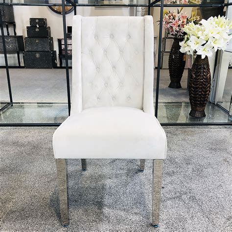 Upholstered by hand in a gray washed velvet over the cushioned seat and backrest, it invites after… Felicity Silver Velvet Dining Chair With Chrome Legs And Ring Knocker | Picture Perfect Home