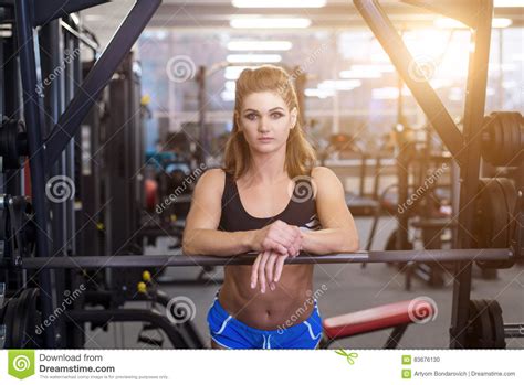Sporty Woman Doing Power Fitness Exercise At Sport Gym Beautiful Girl Working Out In Gym Stock