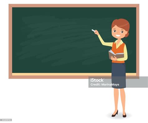 Young Female Teacher Is Writing Chalk On A School Blackboard Stock