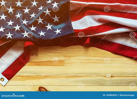 Us Memorial Day With American Flag On Wooden Background Stock Photo