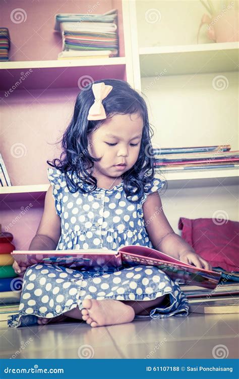 Child Read Cute Little Girl Reading A Book And Sitting On Floor Stock