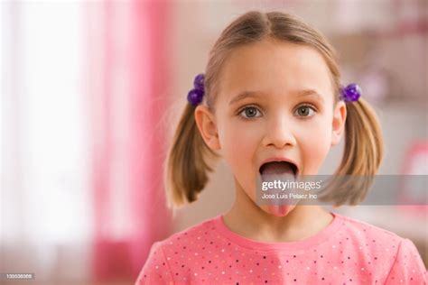 Mixed Race Girl Sticking Out Tongue Photo Getty Images