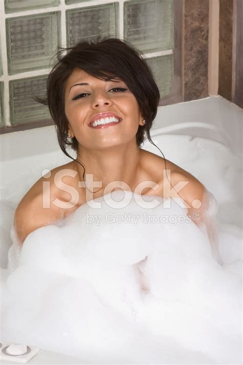 Attractive Young Gorges Woman Taking Bubble Bath Stock