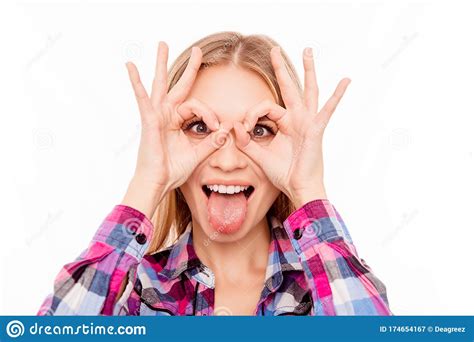 Comic Happy Woman Making Glasses With Fingers And Showing Tongue Stock