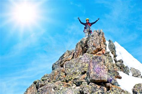 Climber Reaches The Summit Of Mountain Peak Success Freedom And