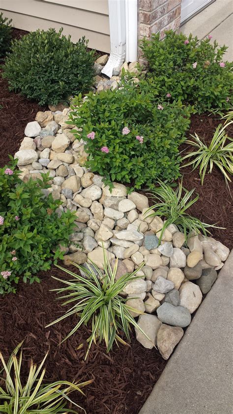 Downspout River Rock Greenacres Landscape And Design