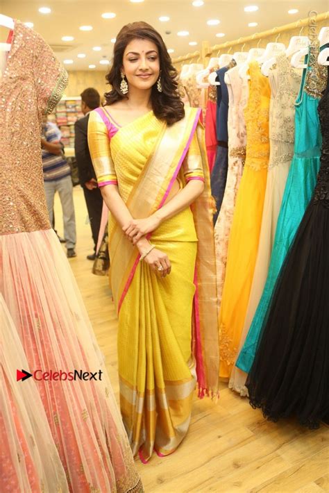 Actress Kajal Agarwal Stills In Golden Silk Saree At Trisha Sesigner