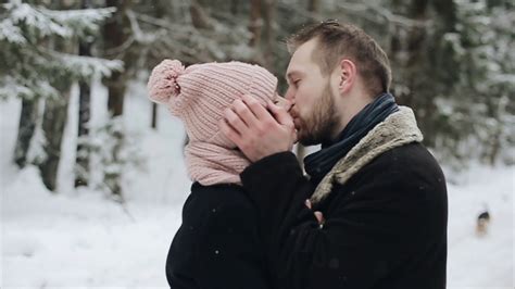 Young Beautiful Caucasian Couple Kissing Under A Snow In A Winter Forest Couple Having Youtube