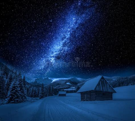 Milky Way Cottages And Snowy Road At Night Tatra Mountains Stock