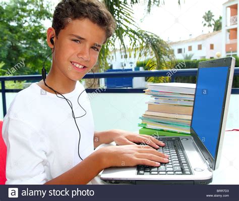 Teenager Student Happy Boy Laptop Earphones Homework In Garden Stock