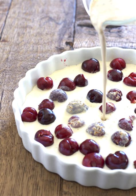 A baked dessert composed of a layer of fresh fruit topped with a thick batter. Cherry Clafouti - Deliciously Organic