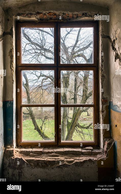 Old Window Of An Abandoned House Inside The Old Castle Stock Photo