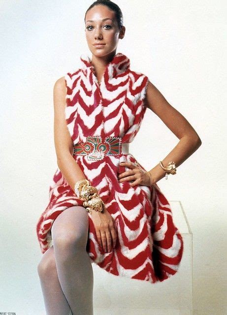 marisa berenson wears a red and white chevron striped dyed mink