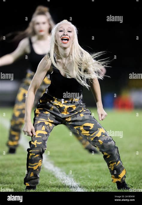 Post Falls High School Dance Team Performing During A Football Game In