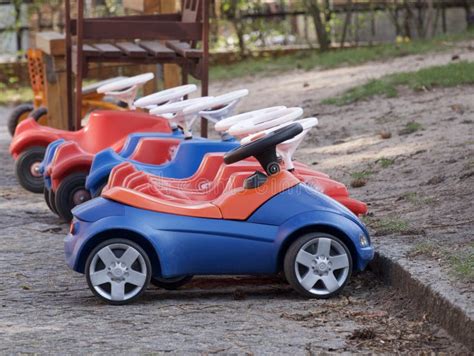 Row Of Colorful Toy Cars For Kids In A Playground Stock Photo Image